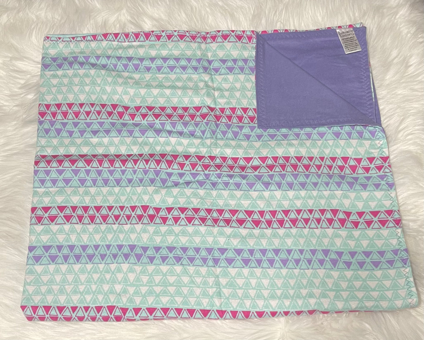 Pink, purple and aqua blue triangle toddler blanket